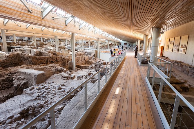 Archaeological Bus Tour To Akrotiri Excavations & Red Beach - The pickup bus and a full southern-island day