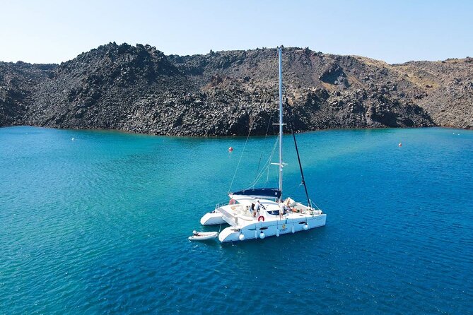 Best of Santorini Private Half-Day Catamaran Cruise with transfer and meal - White Beach and the old lighthouse