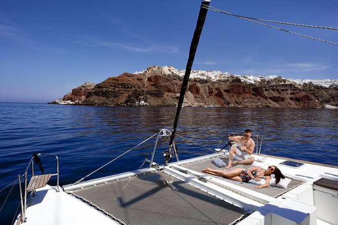 Caldera Cruise with Swim Stops, BBQ on board and drinks! - Pickup from your accommodation to the harbor