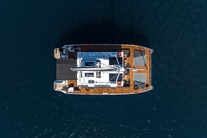 Comfort Max Catamaran Caldera Cruise with BBQ and Drinks - Getting to Ammoudi Bay below Oia