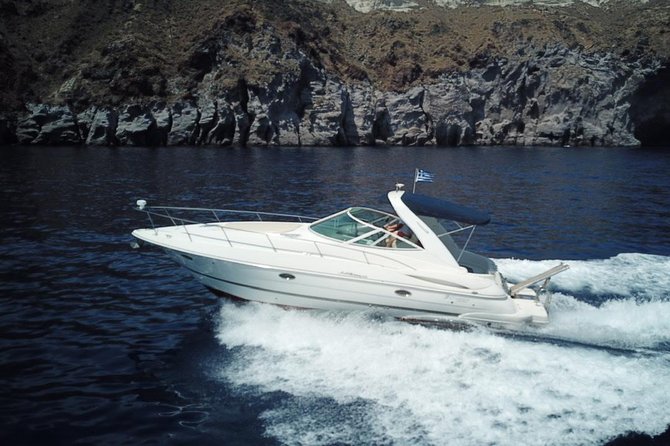 Explore Santorini’s volcano with Alex Private Boat Rental - Oia and Ammoudi from below