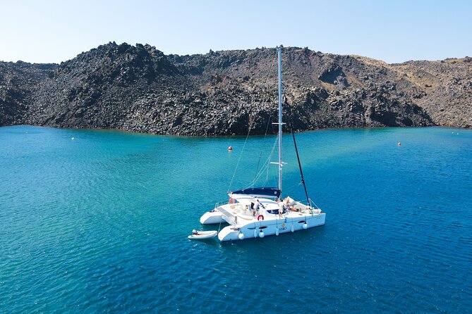 Full Day Santorini Catamaran Private Cruise with meal and transfer - Oia and Fira look different from below