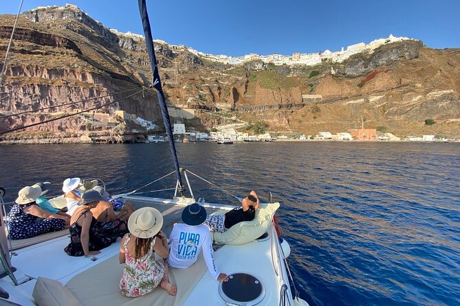 Full Day Santorini Catamaran Private Cruise with meal and transfer - Red Beach reveals Santorini’s volcanic side