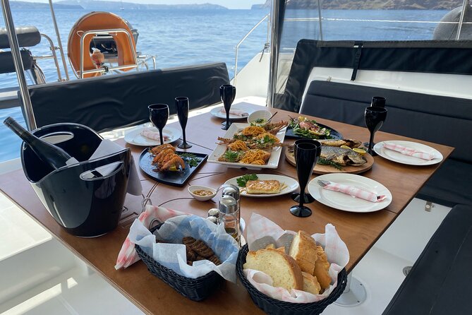 Half Day Premium Catamaran Cruise in Santorini including Oia - The BBQ, open bar, and onboard service