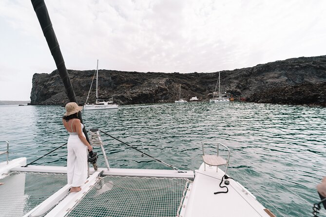 Half-Day Tailor-made Private Catamaran Cruise in Santorini - Limestone formations and clear water