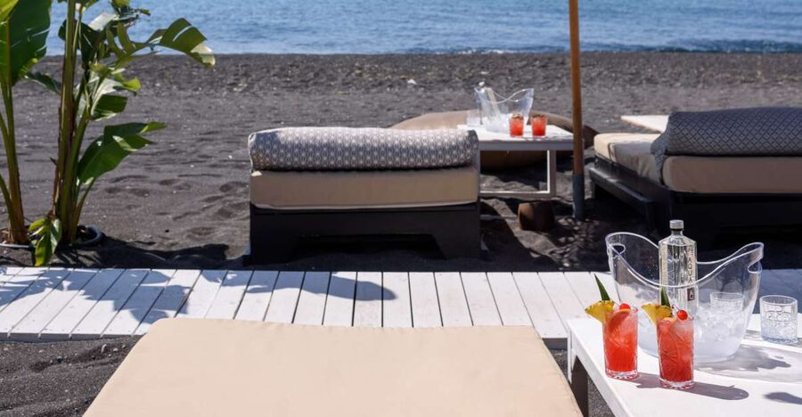 Perivolos Beach: Sun-Bed Experience FortyOne Bar Restaurant - Perivolos water and the volcanic shore