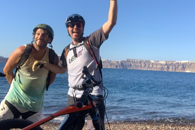 Private Electric Mountain Bike Experience and Tour in Santorini - Reaching Eros Beach by a path away from the crowds