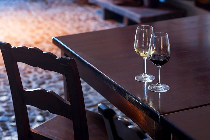 Private Santorini Wine Roads Tour with Tastings - Stop three: wine with a local meal