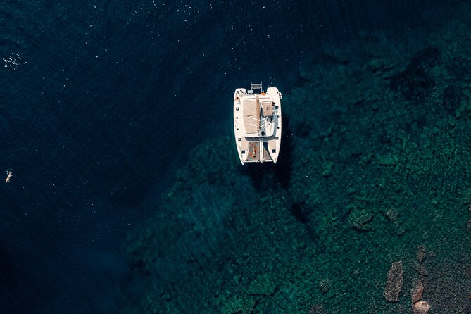 Romantic Sunset Catamaran Caldera Cruise incl. Meal & Drinks - Sailing Santorini’s caldera from the sea