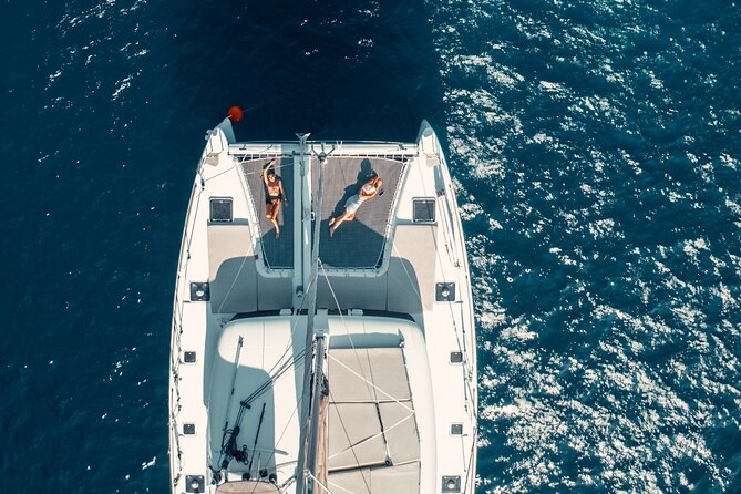 Romantic Sunset Catamaran Caldera Cruise incl. Meal & Drinks - Sunset toward Oia and Ammoudi Bay