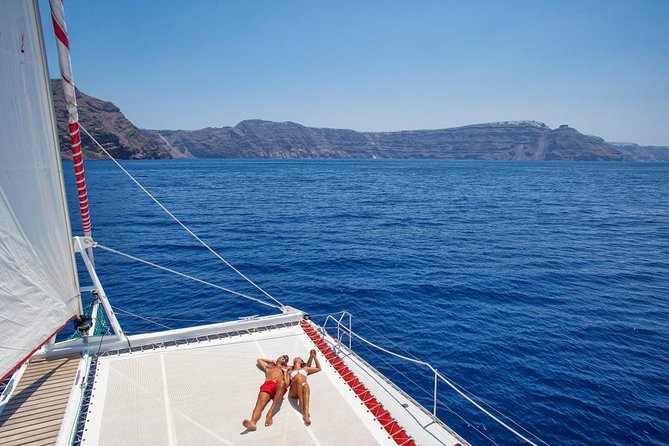 Sailing Catamaran Cruise in Santorini with BBQ, Drinks and Transfer - What the crew and onboard setup are like