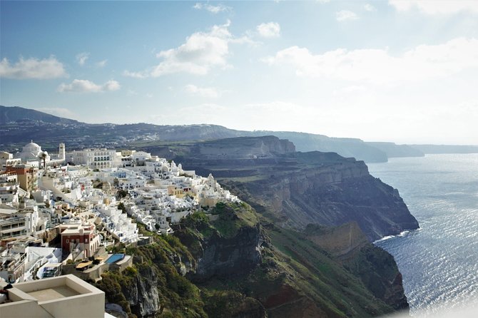 Santorini 6 Hour Private Custom Tour With a Local Driver - Perissa Black Sand Beach shows Santorini’s volcanic side