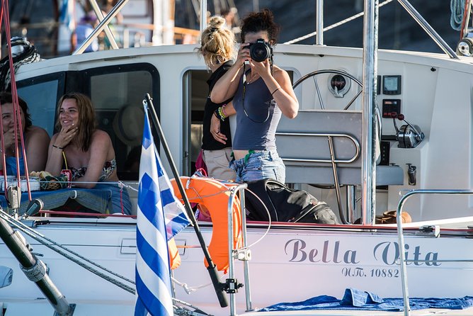 Santorini Adventurous Catamaran Experience with Snorkeling - BBQ Lunch, Wine and a Relaxed Meal at Sea