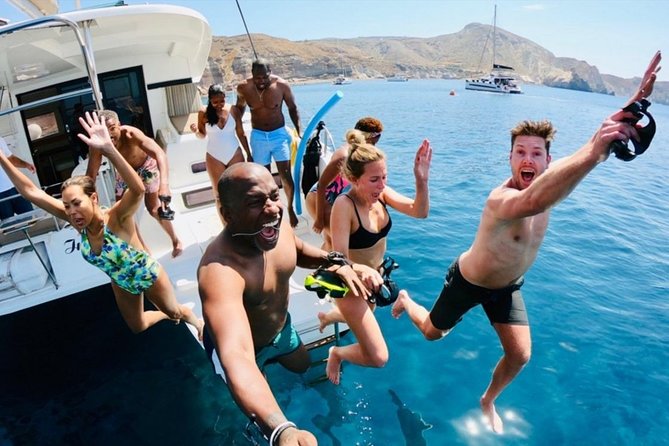 Santorini All-inclusive Catamaran Cruise with Thirassia Stop - Lunch, drinks, and the social side of the boat