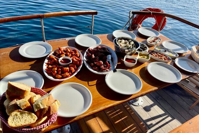 Santorini Caldera Day Traditional Cruise with Meal and Drinks - Red Beach gives you Santorini’s strongest colors