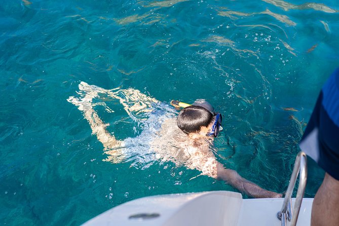 Santorini Caldera Gold Day Cruise with BBQ on board and Open Bar - Sailing around the volcano and into the hot springs