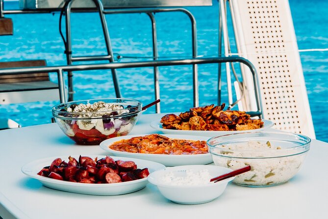 Santorini Caldera Gold Day Cruise with BBQ on board and Open Bar - Ending at Ammoudi Bay below Oia