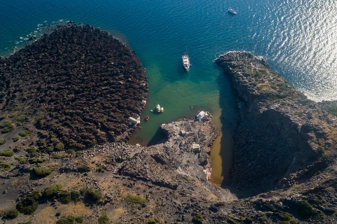 Santorini Caldera Morning Cruise With King Thiras Boat - Cruising beneath Oia on the return