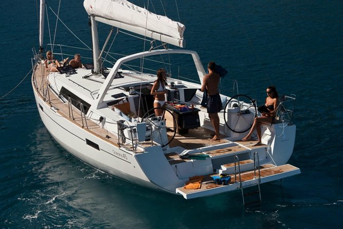 Santorini Caldera Private Sailing Boat Cruise - The Akrotiri lighthouse and volcanic coast