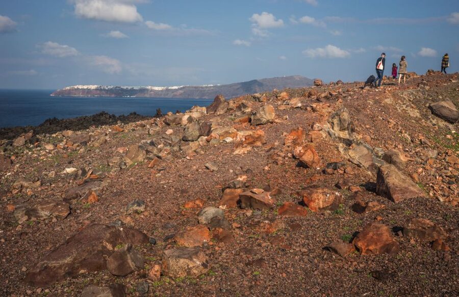 Santorini Caldera: Sunset Cruise with Dinner - Nea Kameni and the rough path to the crater