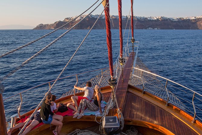 Santorini Caldera Sunset Sailing Cruise with Dinner and Wine - Swimming at Palea Kameni’s hot springs