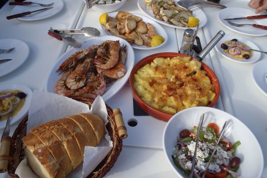 Santorini Caldera: Sunset Sailing Cruise with Meal - Sailing past Akrotiri Lighthouse