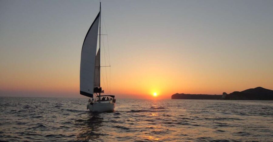 Santorini Caldera: Sunset Sailing Cruise with Meal - Red Beach and White Beach from the water