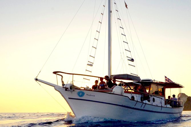 Santorini Caldera Sunset Traditional Cruise with Meal and Drinks - Dinner, drinks, and the long sunset finish