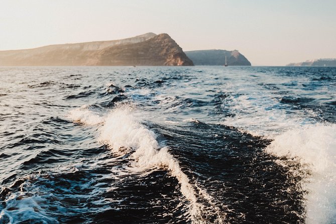 Santorini Caldera Sunset Traditional Cruise with Meal and Drinks - Weather, comfort, and what to bring