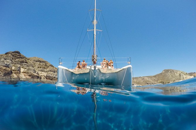 Santorini Catamaran Cruise with Fresh Meal and Open Bar - White Beach and the quiet southern coast