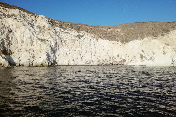 Santorini Catamaran Cruise with Fresh Meal and Open Bar - Lighthouse, Indian Rock, and Mesa Pigadia from the deck