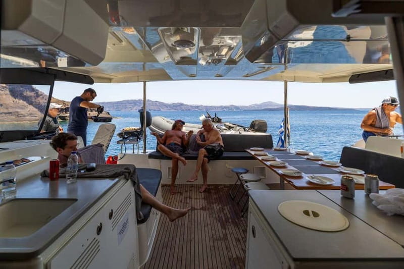 Santorini: Catamaran Cruise with Fresh Meal & Open Bar - Black Mountain coves and the first swim