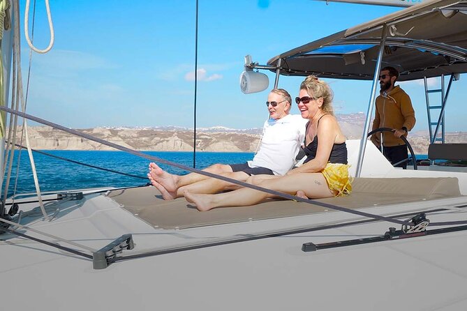 Santorini Catamaran Cruise with Greek Meal, Open-Bar and Sunset - Palea Kameni hot springs and the dark-swimsuit warning