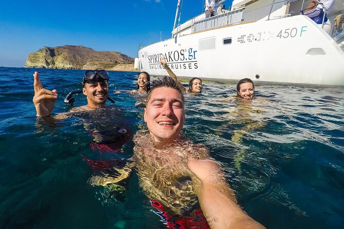 Santorini Classic Catamaran Cruise with BBQ, Drinks and Transfers - Swimming and snorkeling at Mesa Pigadia