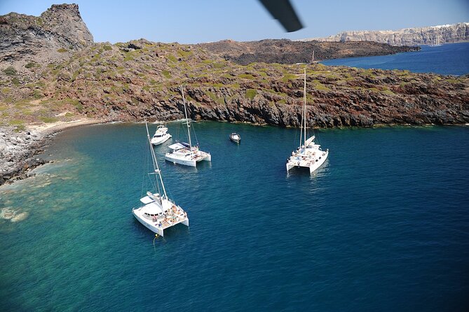 Santorini Classic Catamaran Cruise with BBQ, Drinks and Transfers - Swimming at the hot springs near Palea Kameni