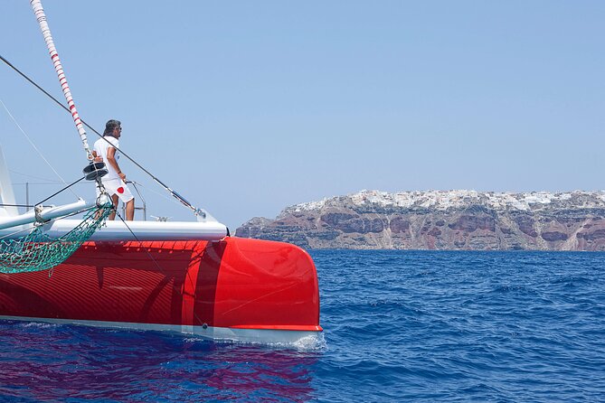 Santorini Cruise on Catamaran with BBQ & Open Bar - Red Beach: photos, snorkeling, and rugged color