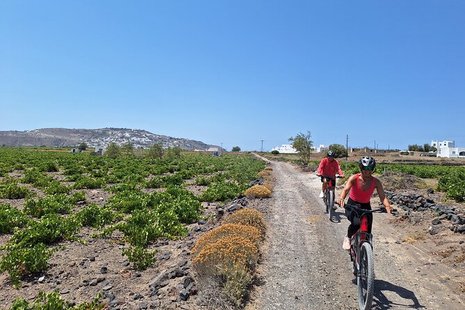 Santorini e-bike sunset tour experience - Vlychada and the black sand at Perivolos