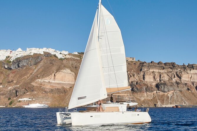 Santorini Gold Catamaran Cruise with BBQ, Drinks and Hotel Pickup - Choosing morning or sunset