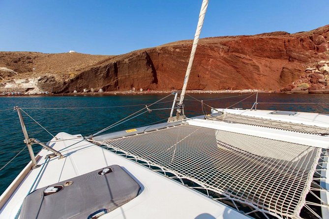 Santorini Half Day Catamaran Private Cruise incl. Meal, Drinks & Free Transport - Palia Kameni, the volcano, and hot springs
