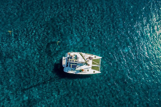 Santorini Half Day Catamaran Private Cruise incl. Meal, Drinks & Free Transport - Red Beach from the water