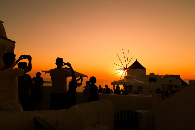 Santorini In One Day Bus Tour with Oia Sunset & optional Sailing - Oia at sunset: the grand finale with a fixed clock
