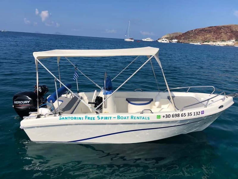 Santorini: License-Free Boat Rental with Ice, Water, & Fruit - Steering across the volcanic caldera