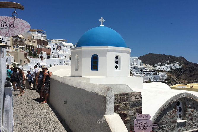 Santorini: Local Life Full Day Tour - Oia starts the day with blue domes and cave houses