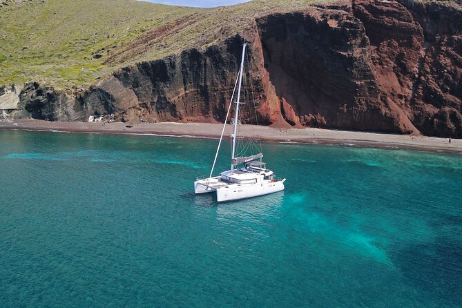 Santorini: Luxury Catamaran Cruise with Fresh Fish BBQ & Drinks - Mesa Pigadia: Black Rock and Clear Water