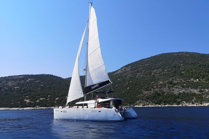 Santorini: Luxury Catamaran Cruise with Fresh Fish BBQ & Drinks - The Lighthouse and the Southern Tip