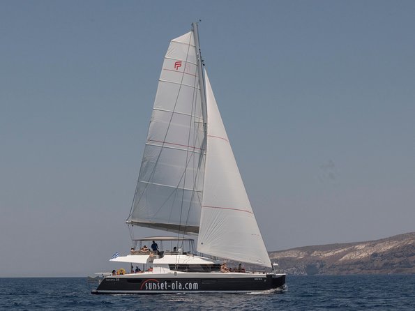 Santorini Luxury Catamaran Day Cruise with BBQ,drinks,transfer - Why seeing Santorini from a catamaran matters