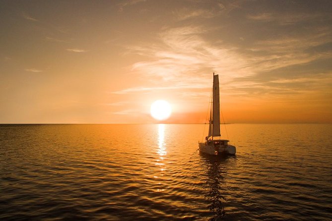 Santorini Luxury Catamaran Sunset Cruise with BBQ, Drink and Transfer - The sunset from the water