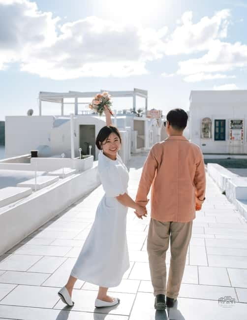 Santorini: Oia Private Couple Photoshoot with 35 Photos - Imerovigli and the Aegean Sea backdrop