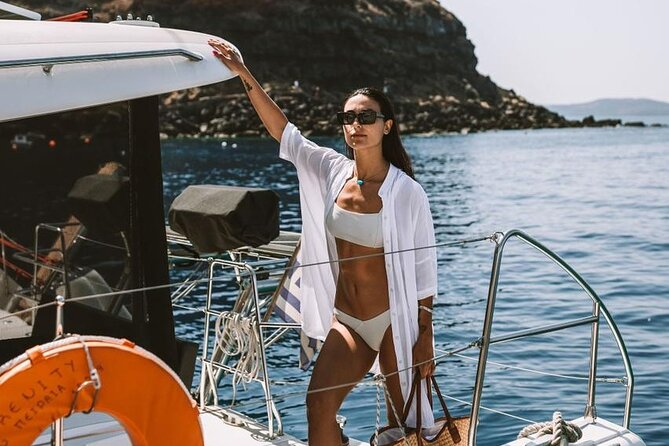 Santorini Oia: Private Sunset Catamaran Cruise with BBQ & Drinks - Mesa Pigadia: a secluded black beach