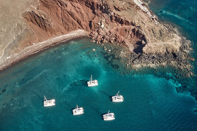 Santorini Oia: Private Sunset Catamaran Cruise with BBQ & Drinks - Setting out from Ammoudi Bay